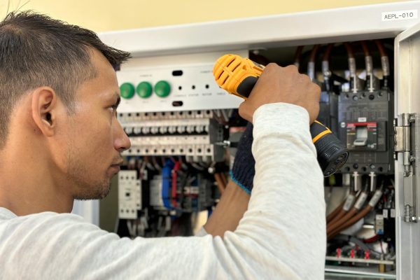 Licensed master electrician working on electrical panel - CR Electric